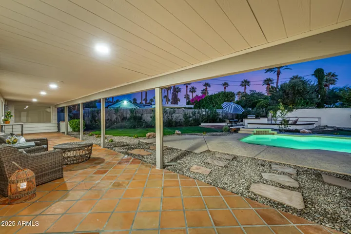 Traditional saltillo tile rounds out the backyard design and complements the brick BBQ Terrace and terra cotta pool tile.