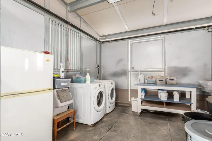 Stall with included fridge/washer/dryer