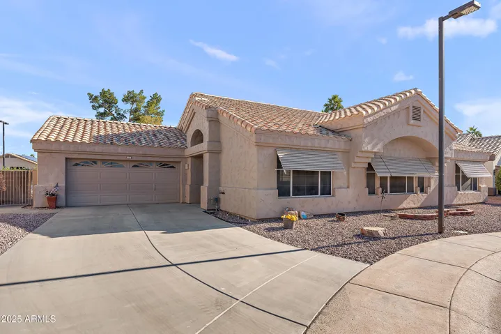 LONG DRIVEWAY AND ROOM FOR GOLF CART IN GARAGE.