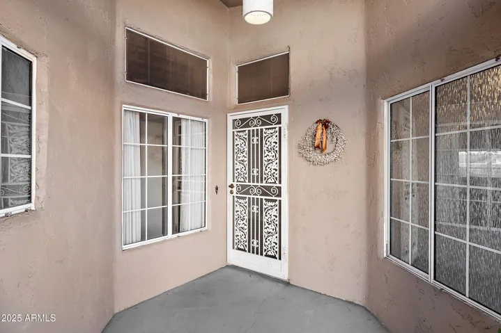 FRONT PORCH AND SECURITY SCREEN DOOR.