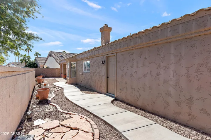NEWER CONCRETE WALKWAY TO GATE.