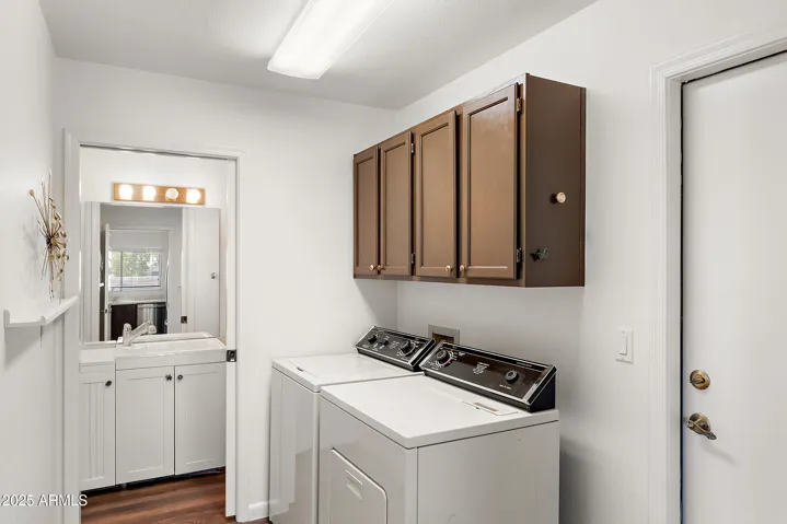 LARGE LAUNDRY ROOM OFF KITCHEN AND GARAGE ENTRY AND BONUS A HALF BATH.