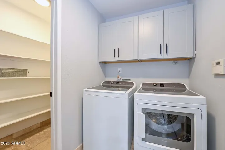 Inside laundry next to walk-in pantry