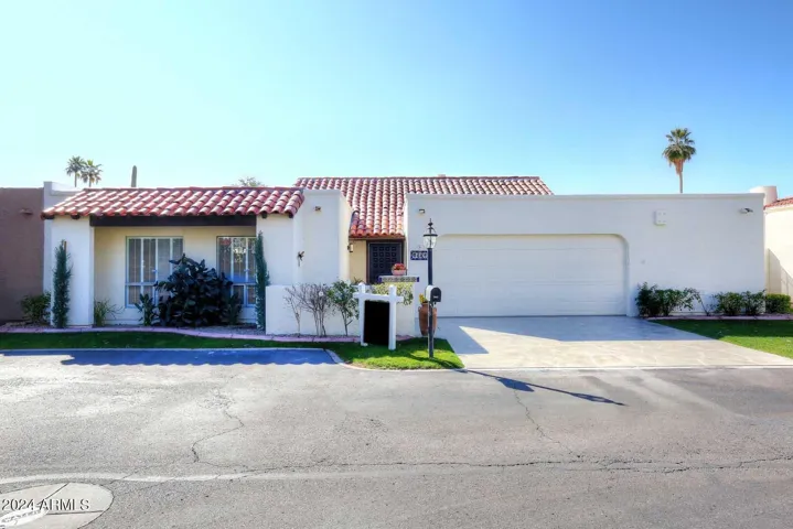 Freshly updated driveway and 2-car garage in gated community