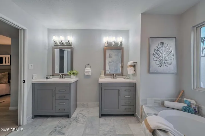 Double sinks, marble flooring
