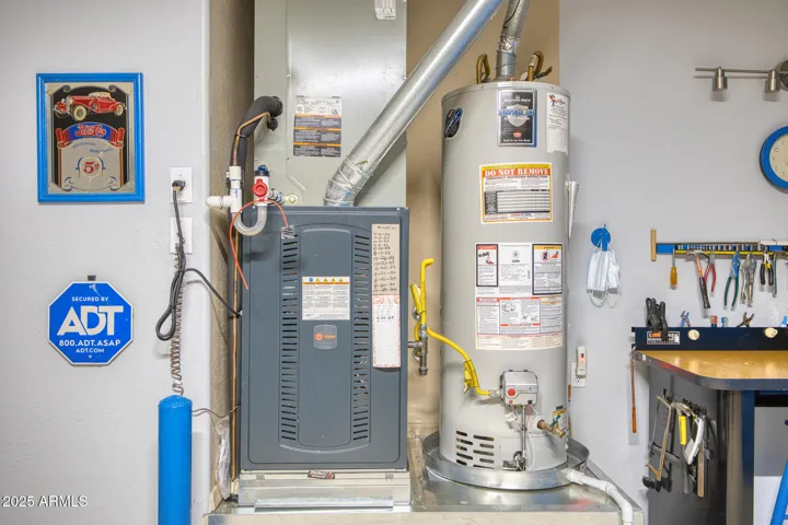Newer HVAC and water heater - tools and workbench to the right