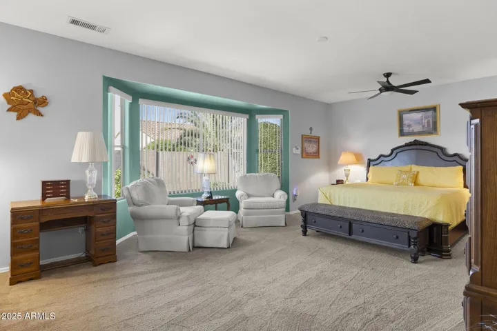 Oversized primary bedroom from doorway - Bay window offers sitting area
