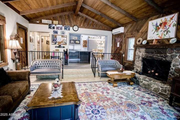 Vaulted Ceiling, Wood Accents & Beams, Stone Fireplace
