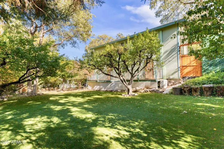 Low Maintenance Turf Backyard, Running Pond, Mature Trees