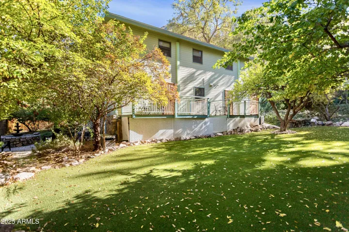 Low Maintenance Turf Backyard, Running Pond, Mature Trees