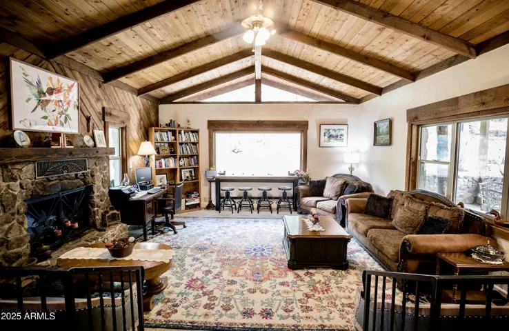Expansive Windows, Wood Beams, Stone Fireplace
