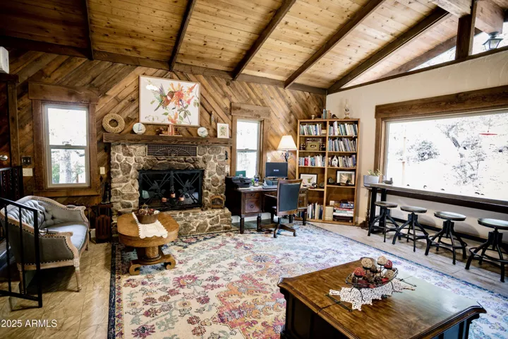Expansive Windows, Wood Beams, Stone Fireplace