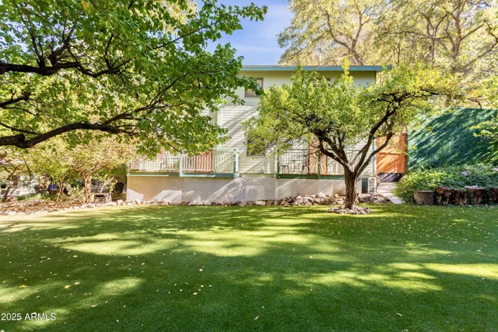 Low Maintenance Turf Backyard, Running Pond, Mature Trees