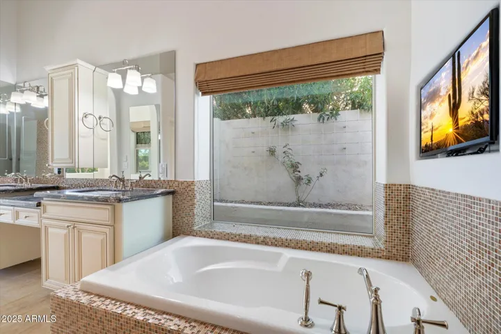 Large Tub with 55 inche TV on wall