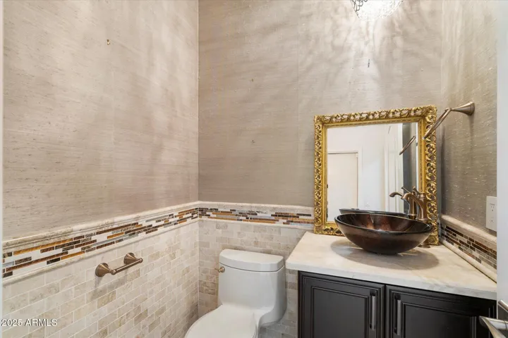 Powder Room off Garage and Formal Entry