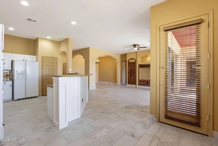 Kitchen breakfast bar opens to great room.