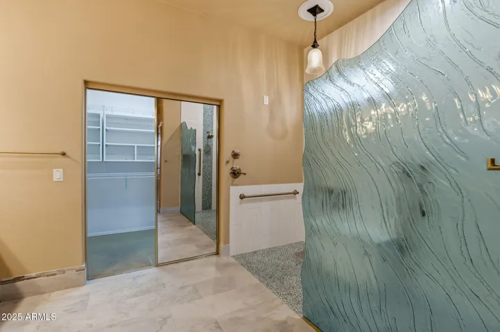 The redesigned primary bathroom features refined, modern finishes.