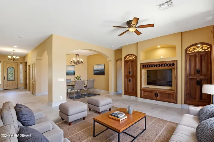 Open great room floor plan seamlessly connects the kitchen, living, & dining areas. Virtual Staging.