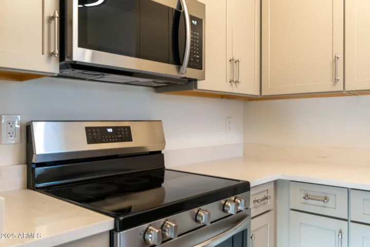 New stainless steel appliances, custom cabinetry and sleek countertops.