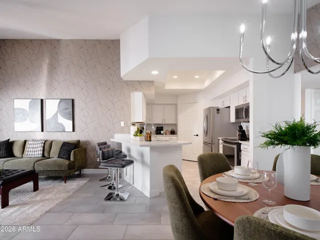 Opens to kitchen and dining