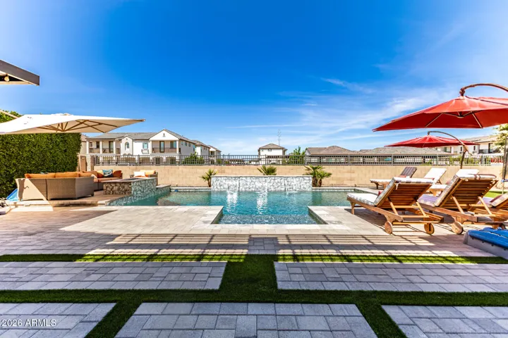 Pool w/expansive pavers, gas fire pit area & built in BBQ entertainment area.