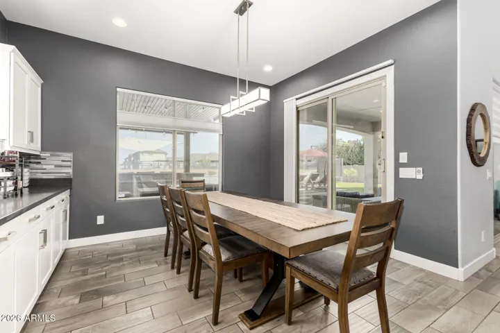 Sliding doors open to back patio / pool area