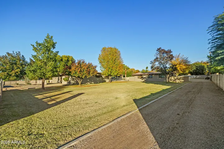 Side driveway to casita and back gravel parking