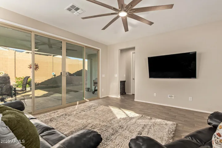 Bright and airy living space with expansive windows, modern finishes, and open-concept flow. Ideal for relaxing or hosting, with seamless connection to the kitchen and backyard.