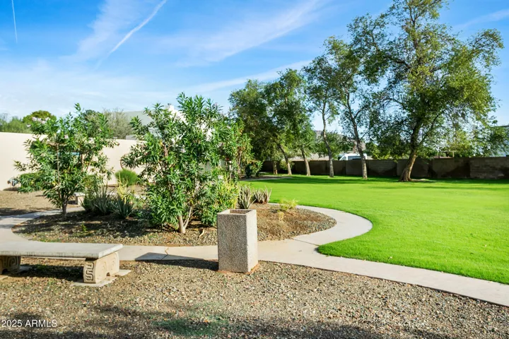 Community grounds; 10+ park-like acres with walking paths, grass and shady trees