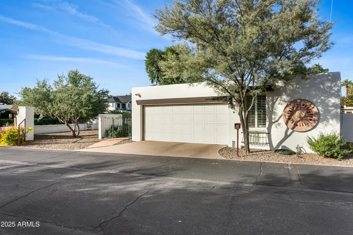 Exterior front with 2 car garage, end unit