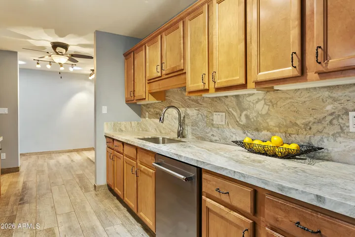 Kitchen with brushed marble countertops, Wolf gas range
