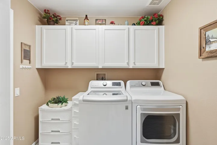 Spacious Laundry Room with cabinet storage!