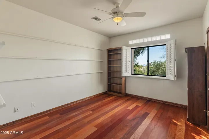 West guest room two with bookcases that convey