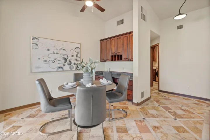 Breakfast nook featuring built-in cabinets and desk