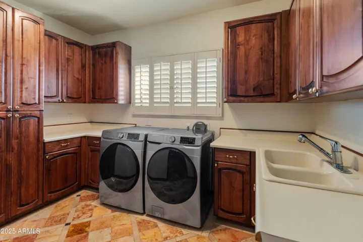 Laundry room with washer and dryer that convey