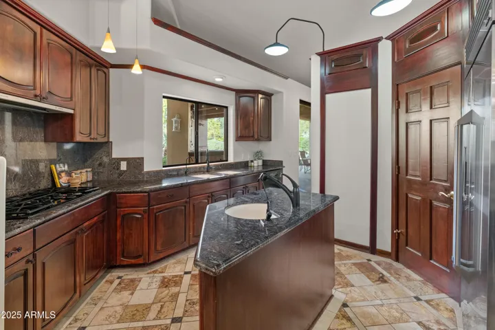 Kitchen featuring gas, stove, pantry, and dishwasher