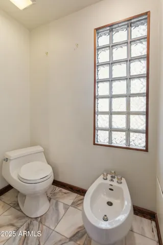 Toilet room with bidet