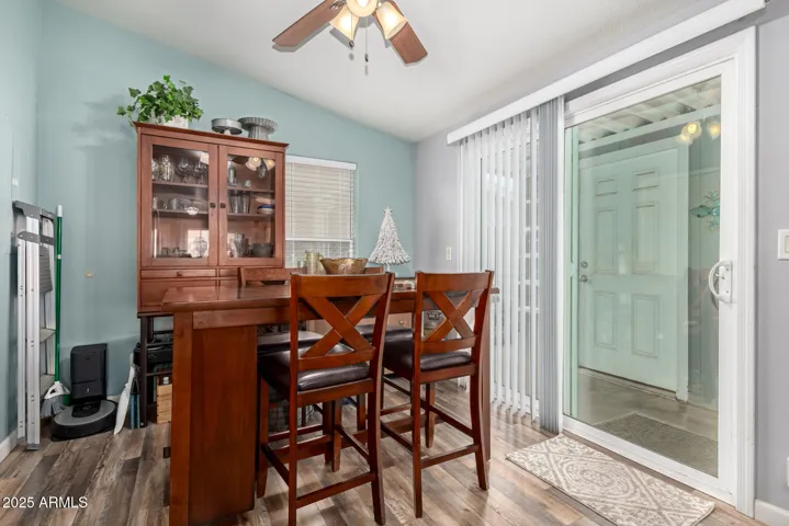Dining area with sliding glass door to carport and storage shed