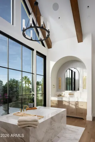 Spilling marble, arched vanities, pitch vault, wall of glass, all meticulously thought through for you.