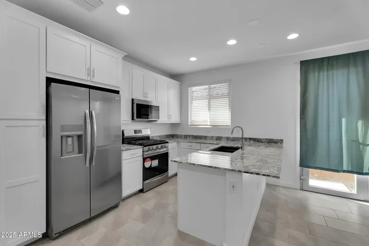 Fully functional guest suite kitchen. Gas stove, dishwasher, microwave and frig.