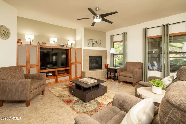 Gas fireplace, ceiling fans throughout and no carpet here!