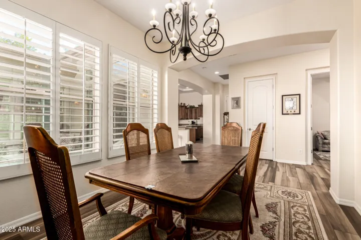 Bright Formal Dining Room Expansive Shuttered Windows, perfect for Hosting Family & Guests