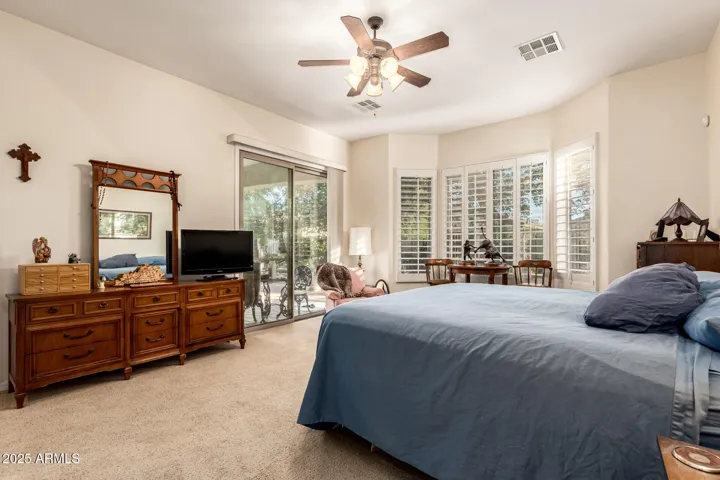 Absolutely Amazing Primary Bedroom, Offers Privacy with it's Walk-Out Sliding Doors to the Covered Back Patio, it's very own Adjacent Office with a door, TWO Walk in Closets an Ensuite Bath Including Jetted Tub, Stand alone Shower Separated Vanity Sinks & a Private Water Closet, Ohh & did I mention the Shutters on the windows here as well.