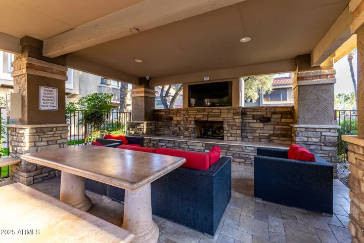 Relax by the Fireplace in the Outdoor Living Community Space