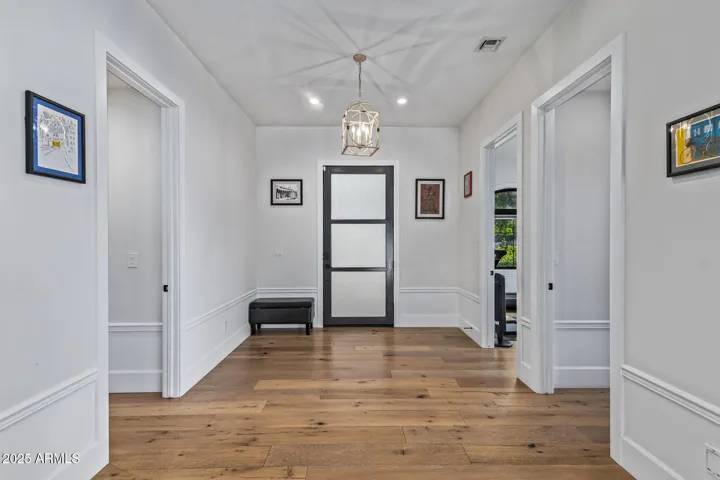 Foyer with Junior Primary Suite and Exercise Room and Powder Room located off of it