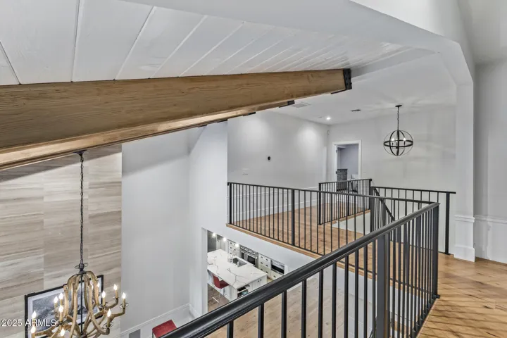 Grand upstairs balcony leads to Primary Suite