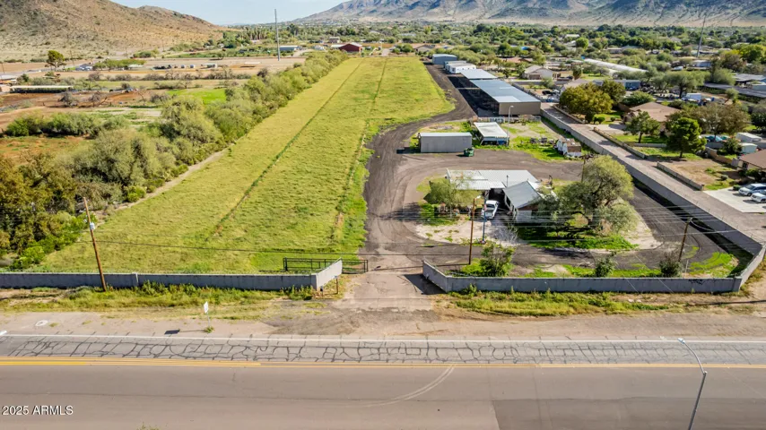 9.672 acres, 2 parcels on county island, frontage on 51st Ave.