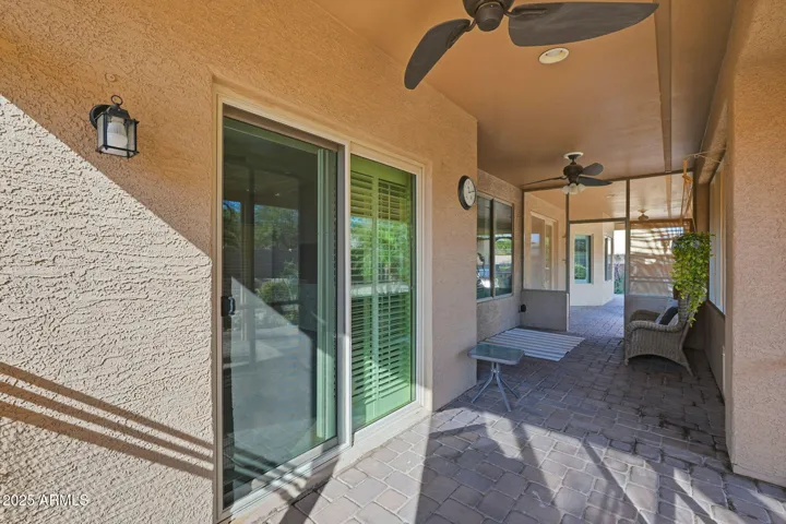 This enclosed patio can be accessed by the primary suite or from the main back patio