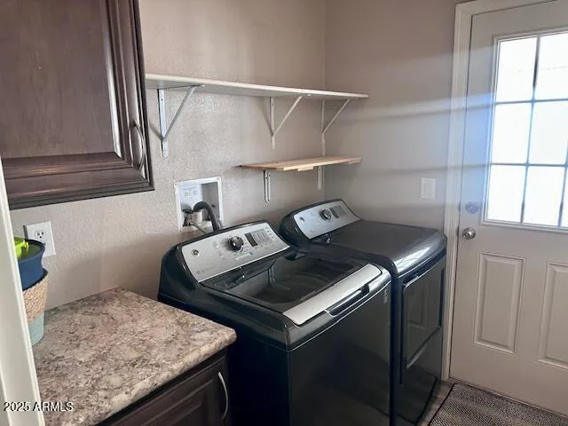 Laundry Room with Cabinets & Door to Carport