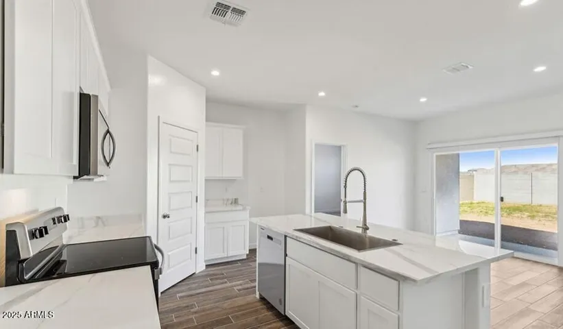 Photos are of a spec and may vary in color, interior selections and design
